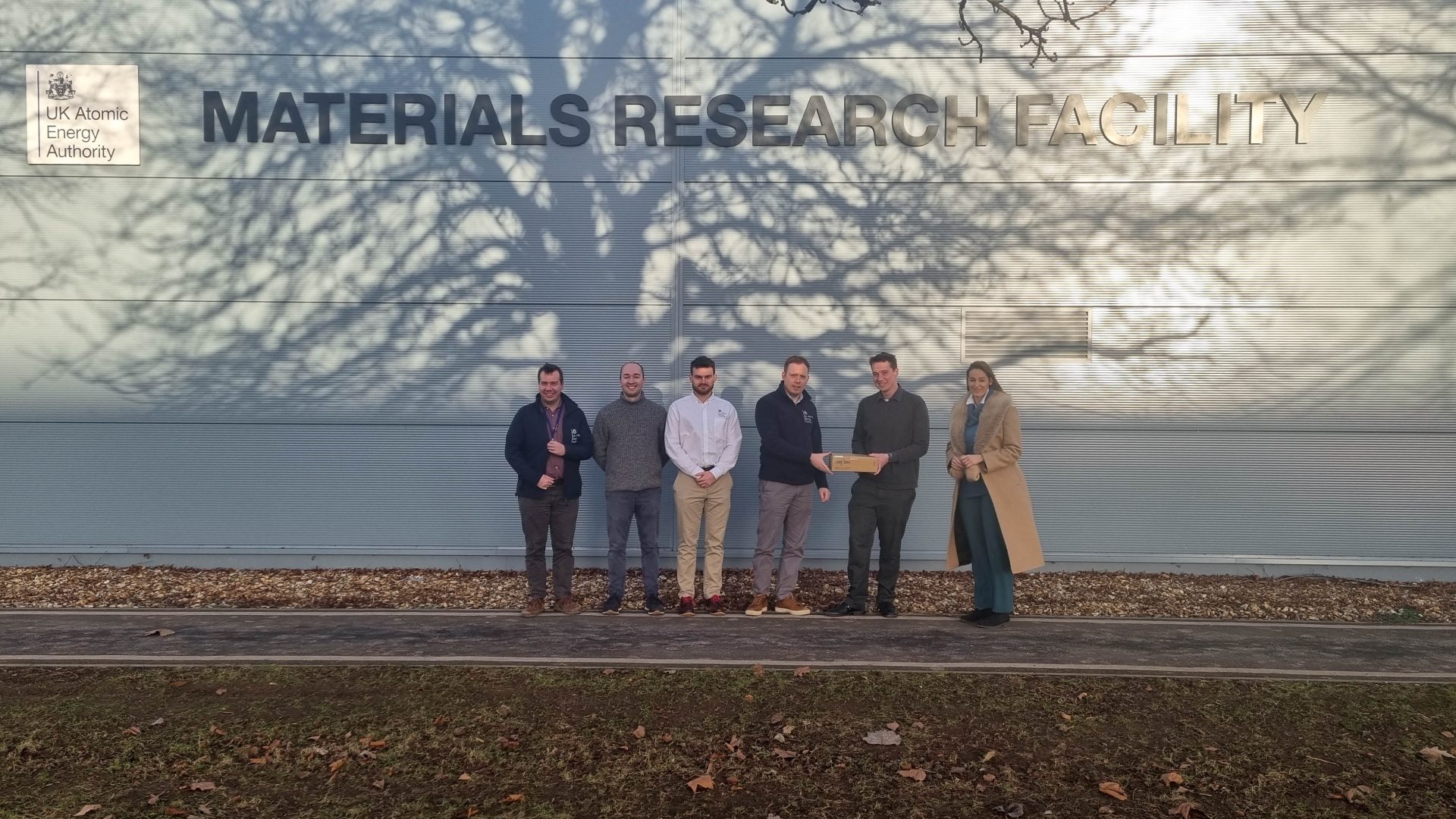 A specimen of ‘fusion grade’ silicon carbide composite made by KF in Japan, being handed over to UKAEA for experimentation. L-R: Dr Alex Leide (UKAEA), Dr Max Rigby-Bell (UKAEA), George Clark (UKAEA), Dr James Wade-Zhu (UKAEA), Andy Wilson (Kyoto Fusioneering), Vojna Ngjeqari (Kyoto Fusioneering).