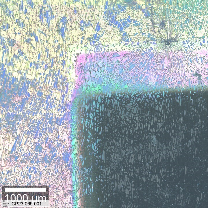 Optical Image Stitch of Grade 91 steel with alumina coating. Irradiated with 35 MeV Au6+ ions at 550°C for 64 hours, the dark area was masked off from the ion beam. 